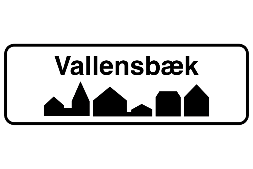 Byskilt med teksten "Vallensbæk" i fokus, der fremhæver bynavnet og understøtter vores malerfirma i Vallensbæk.
